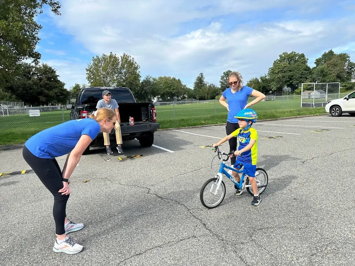 A Ready to Pedal instructor working one-on-one with a child